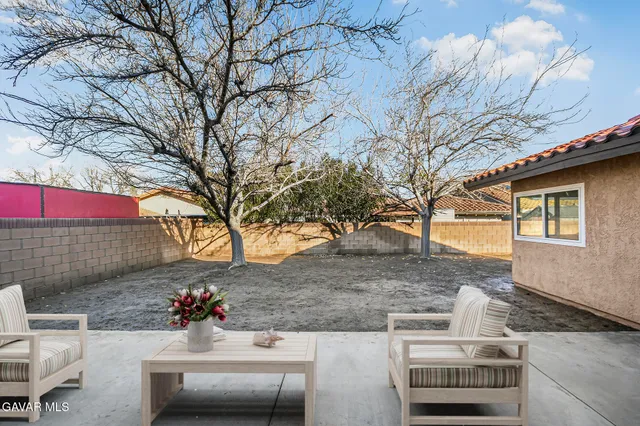 a view of house with outdoor seating