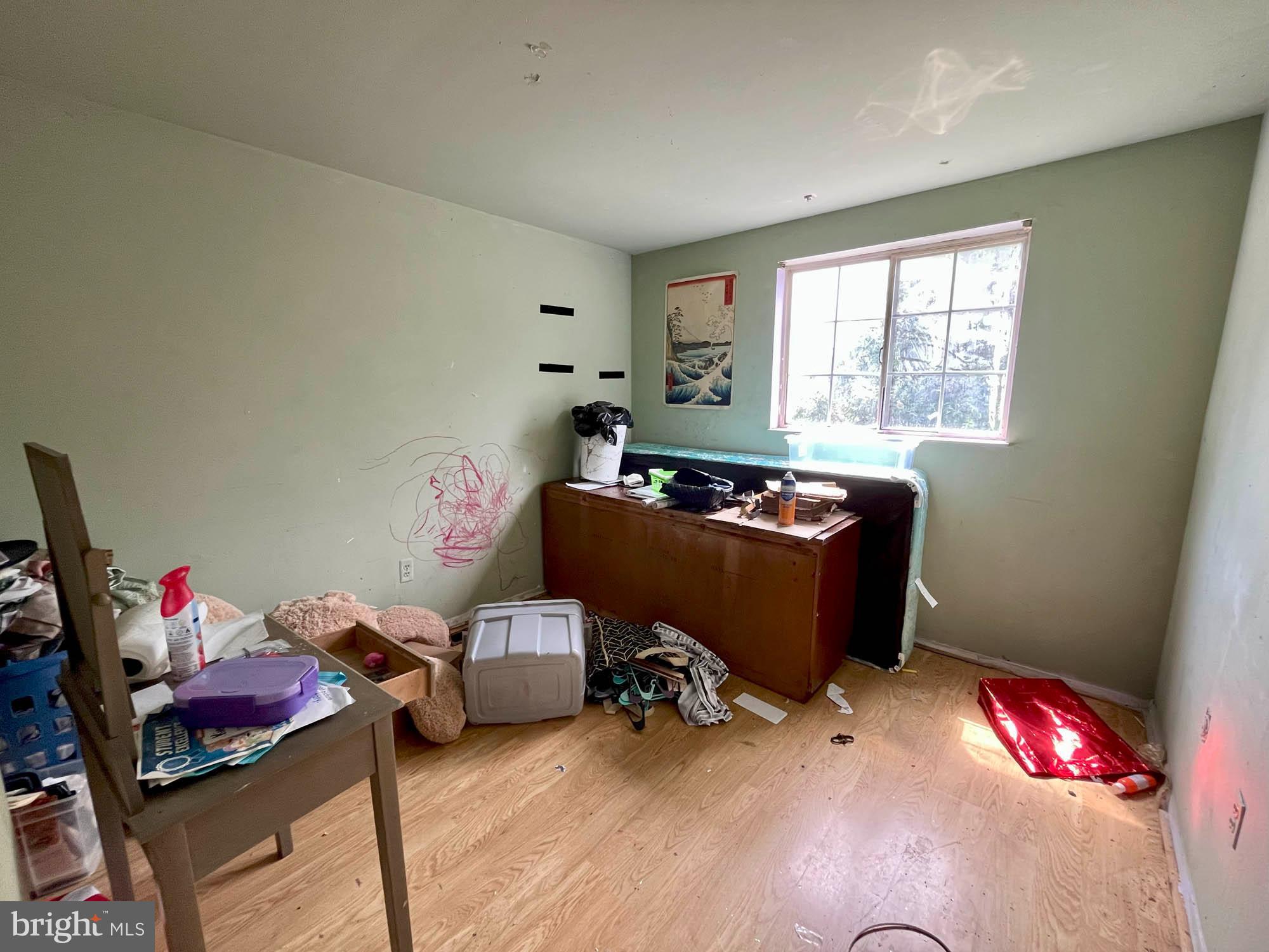 12366 Bonfire Drive Reisterstown, MD 21136 - Photo 15 of 20 a room with furniture a flat screen tv and a window