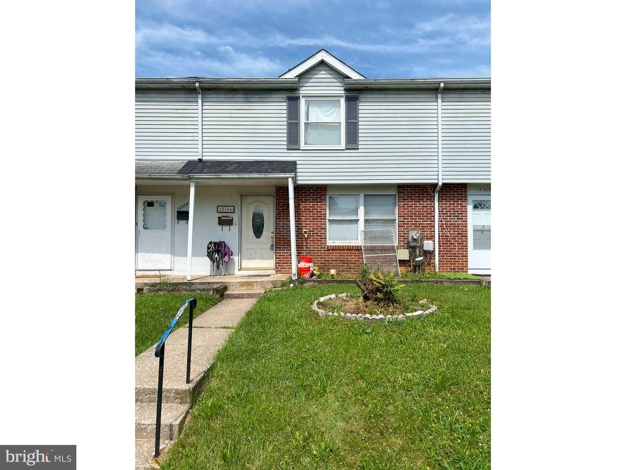 12366 Bonfire Drive Reisterstown, MD 21136 - Photo 2 of 20 a front view of a house with a yard