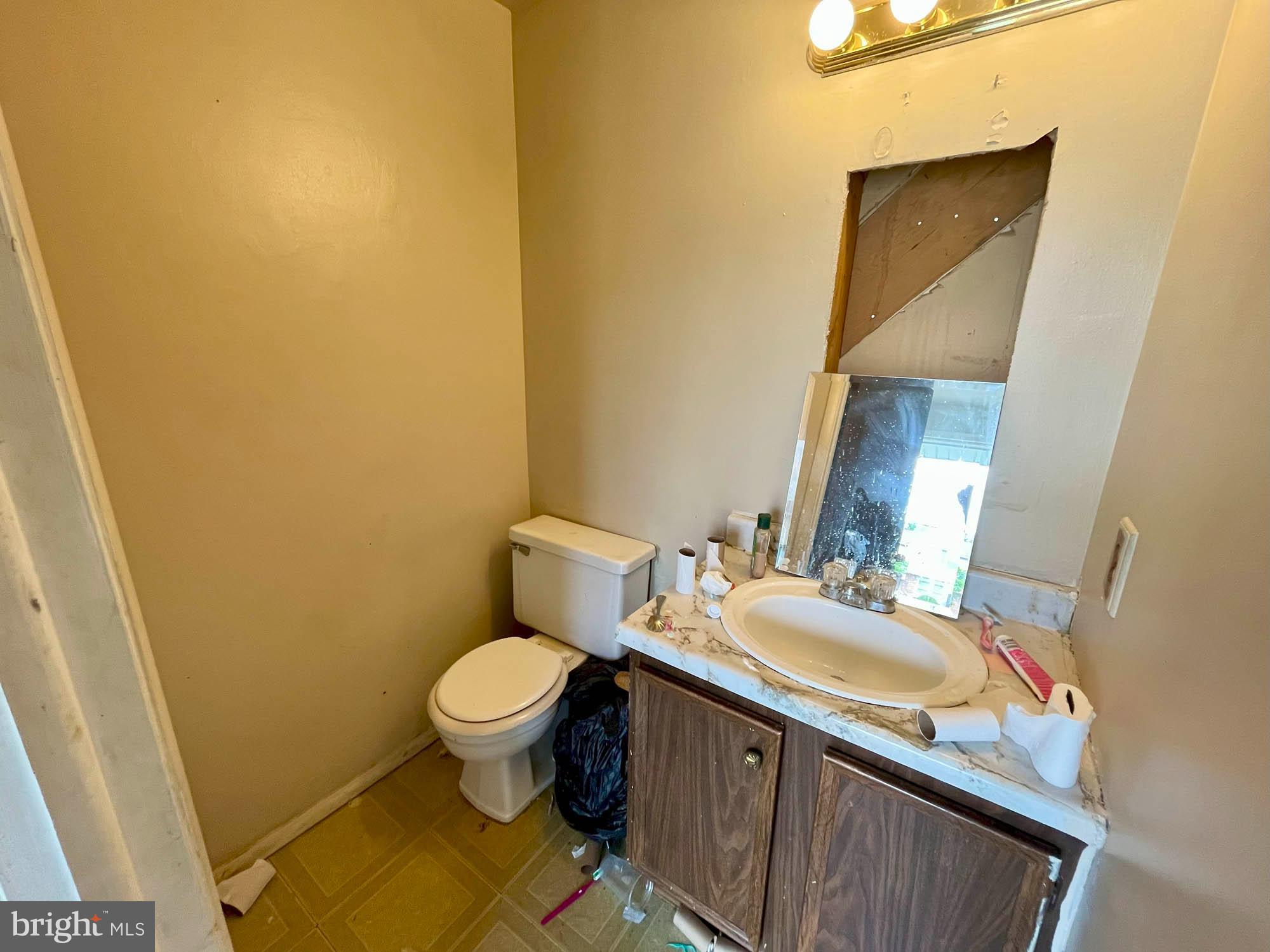 12366 Bonfire Drive Reisterstown, MD 21136 - Photo 7 of 20 a bathroom with a granite countertop toilet and sink