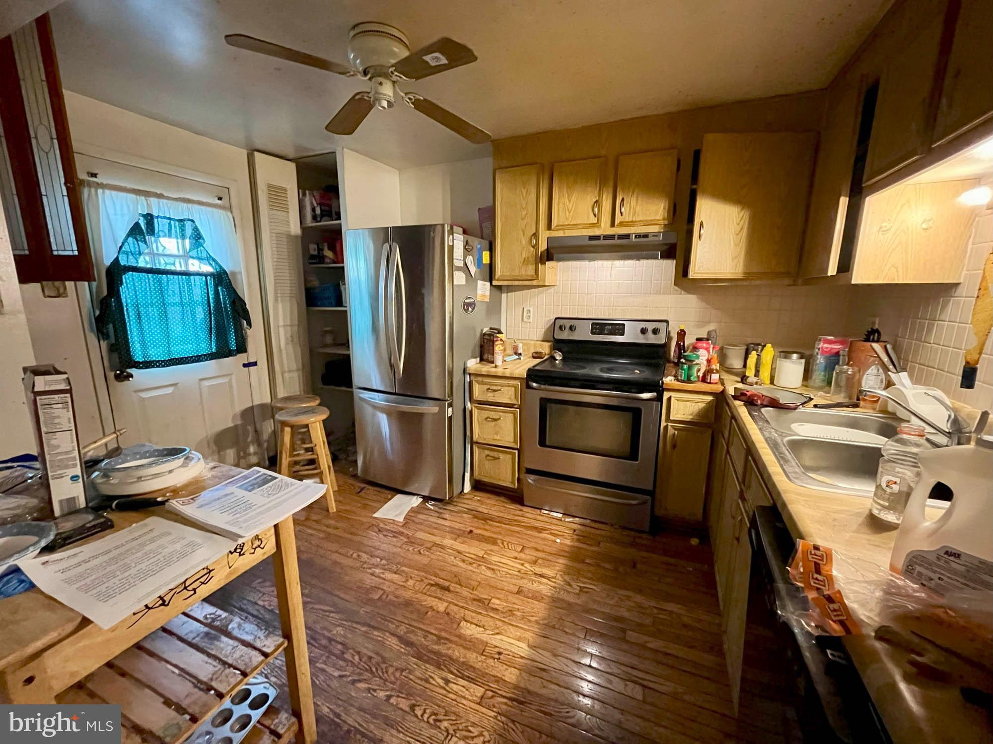 12366 Bonfire Drive Reisterstown, MD 21136 - Photo 8 of 20 a kitchen with a sink appliances and cabinets