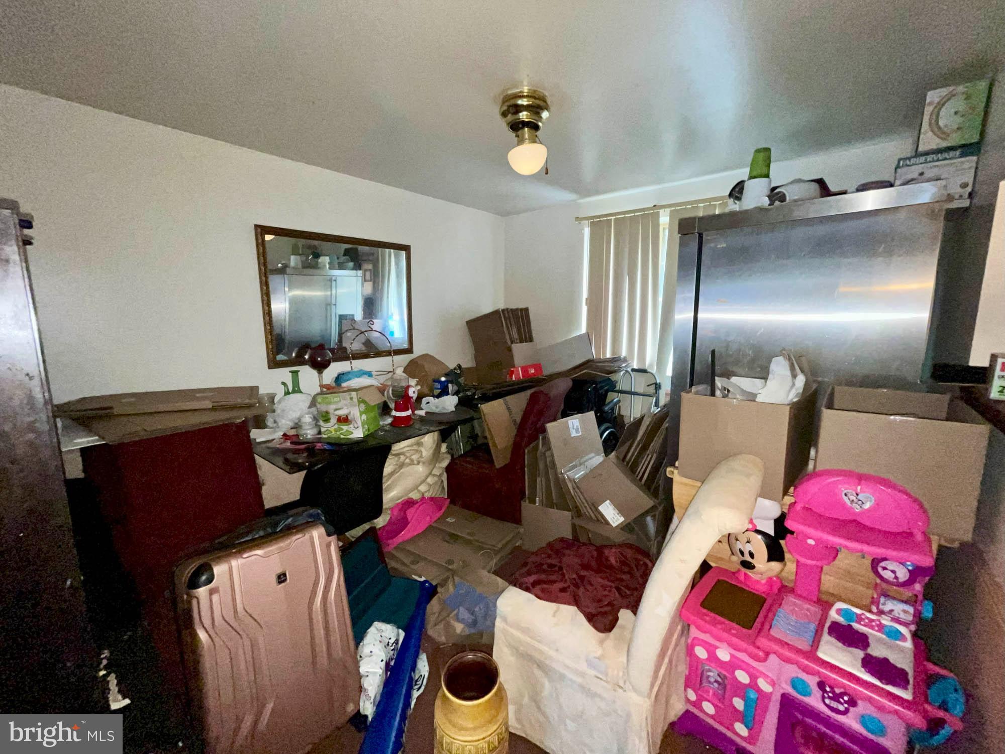 12366 Bonfire Drive Reisterstown, MD 21136 - Photo 9 of 20 a living room with furniture and a chandelier