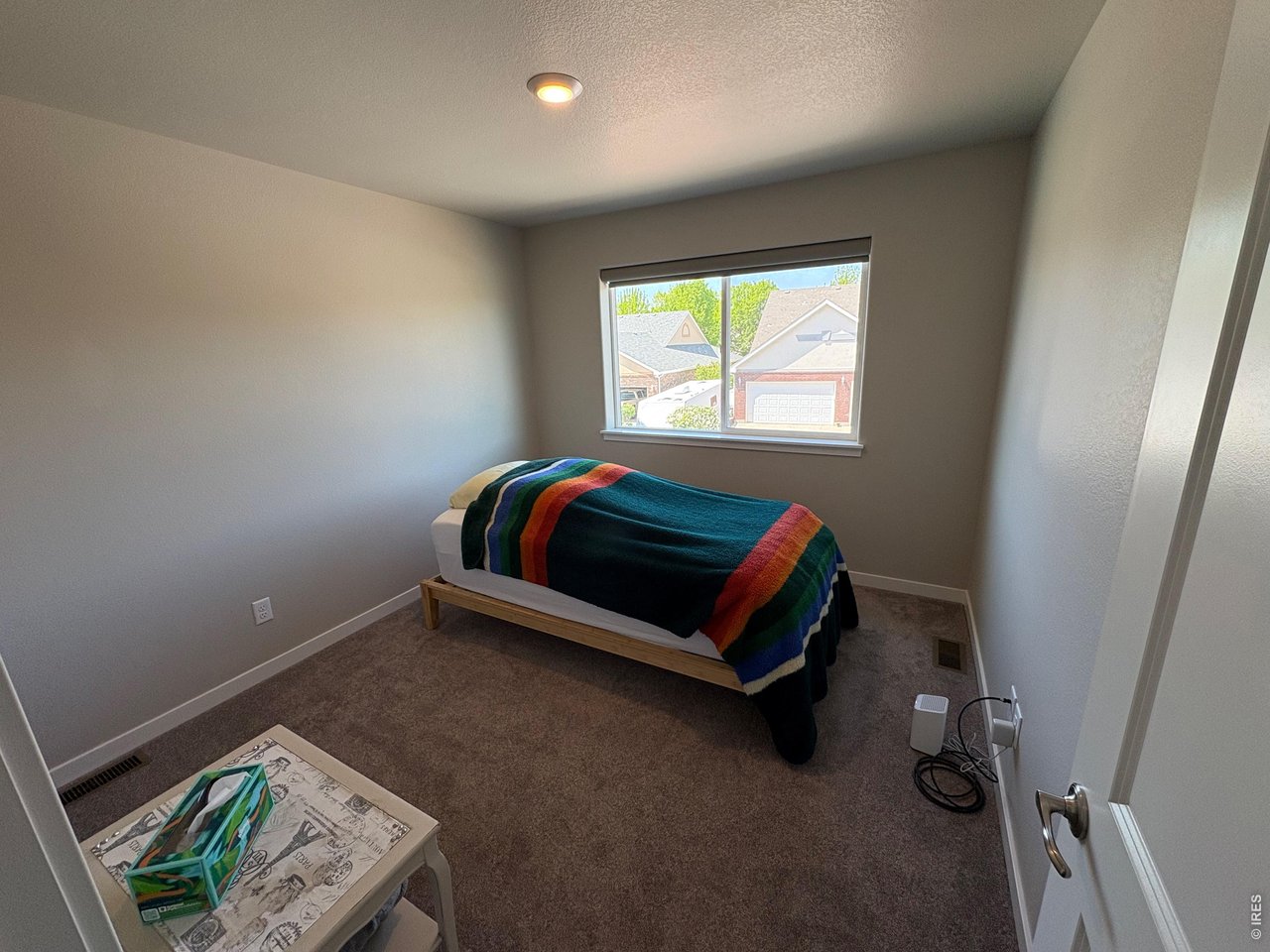 333 Pyramid Peak Street Berthoud, CO 80513 - Photo 20 of 21 a room with a bed and a window