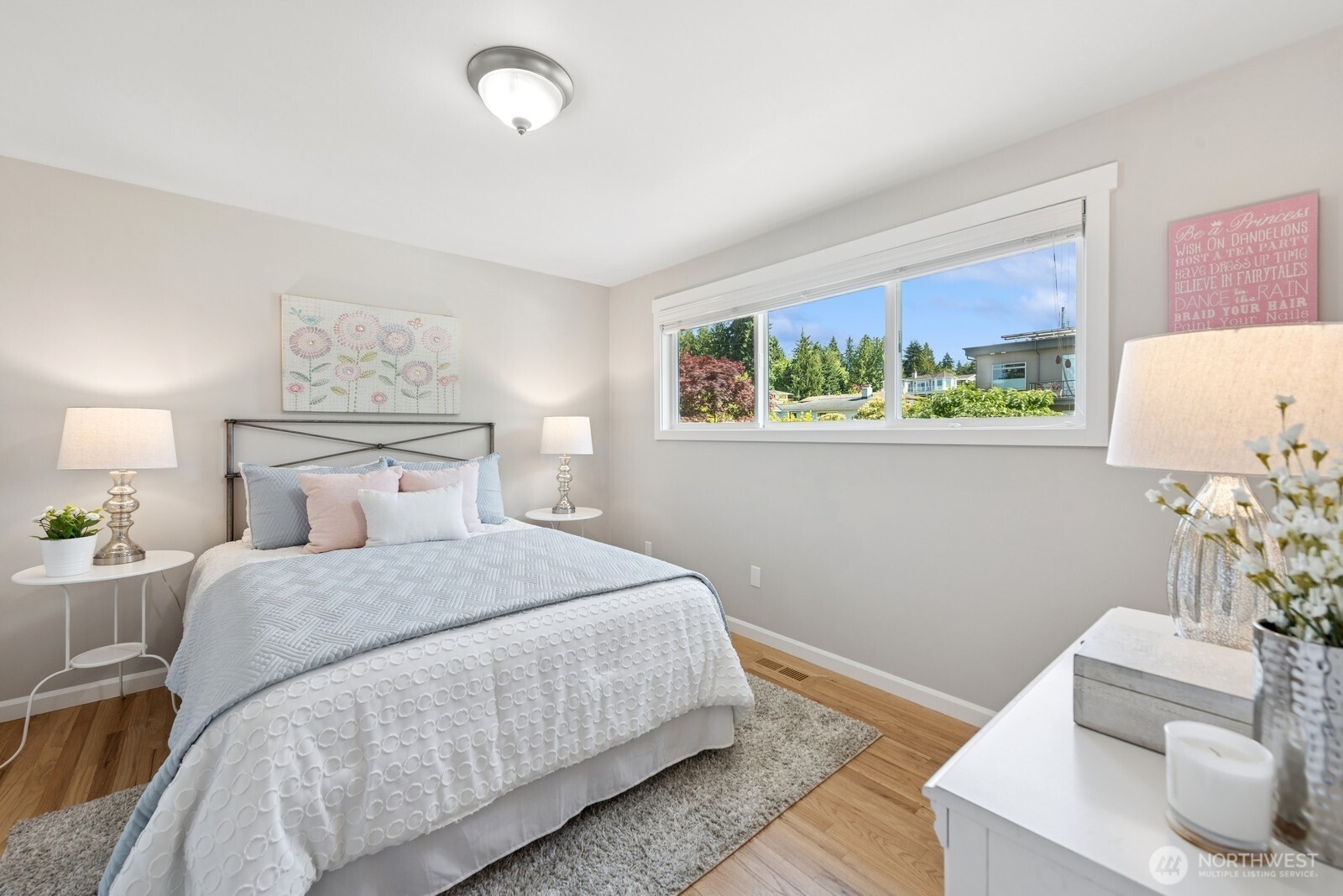 918 Daley Street Edmonds, WA 98020 - Photo 13 of 32 a bedroom with a bed and a painting on the wall