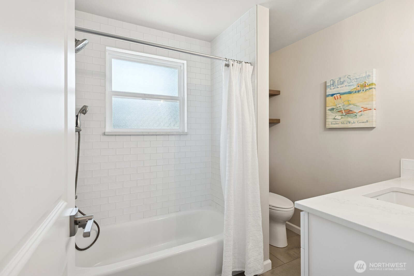 918 Daley Street Edmonds, WA 98020 - Photo 14 of 32 a bathroom with a shower a toilet and a sink