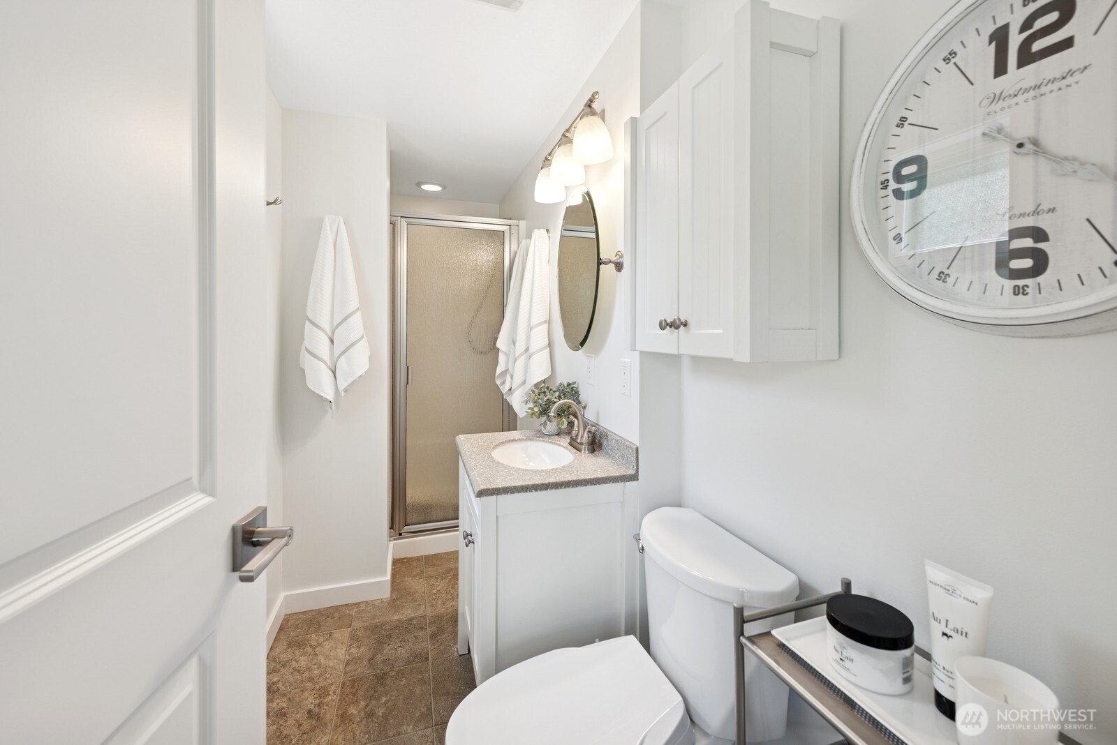918 Daley Street Edmonds, WA 98020 - Photo 21 of 32 a bathroom with a sink toilet and shower