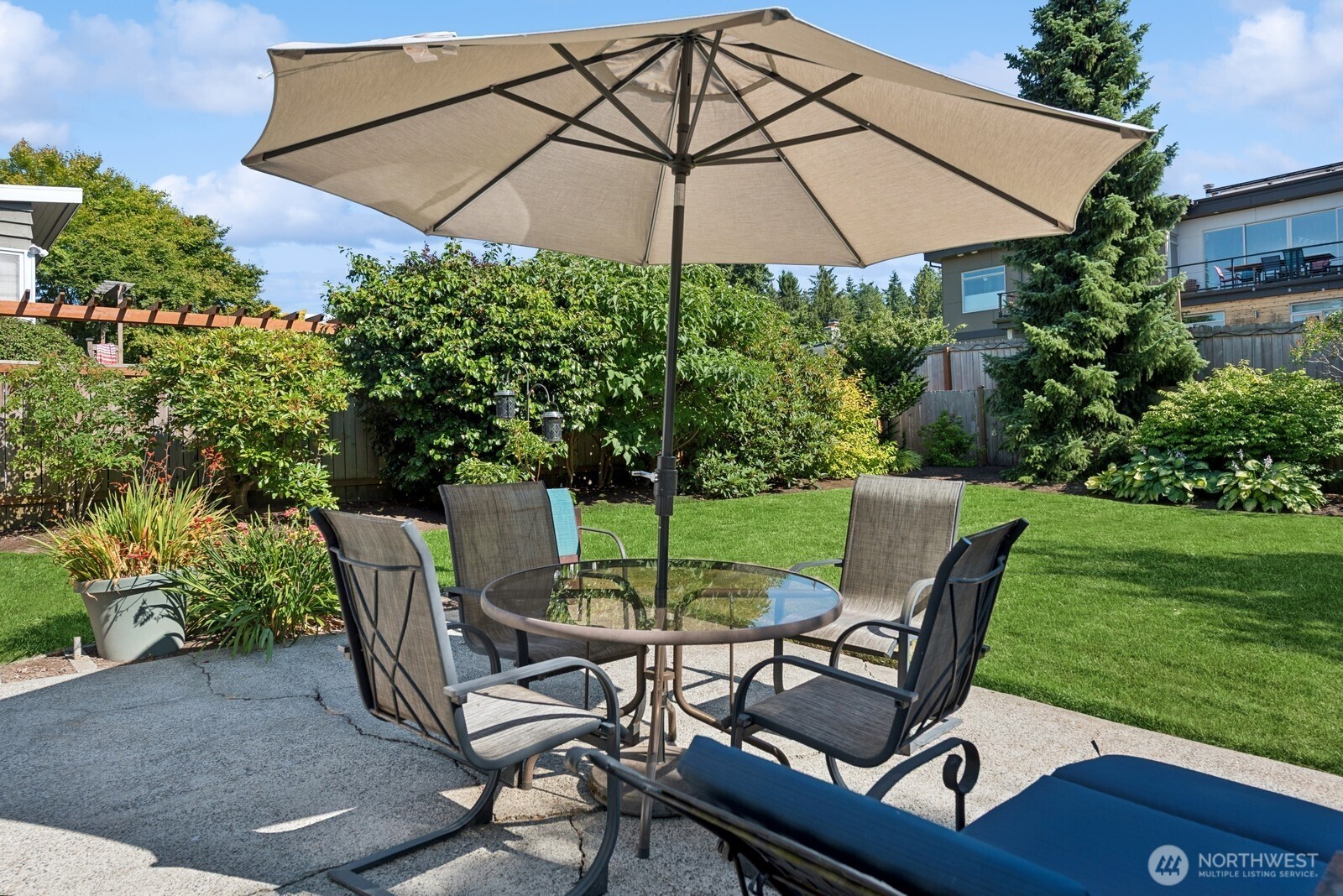 918 Daley Street Edmonds, WA 98020 - Photo 26 of 32 a view of a backyard with furniture and a garden