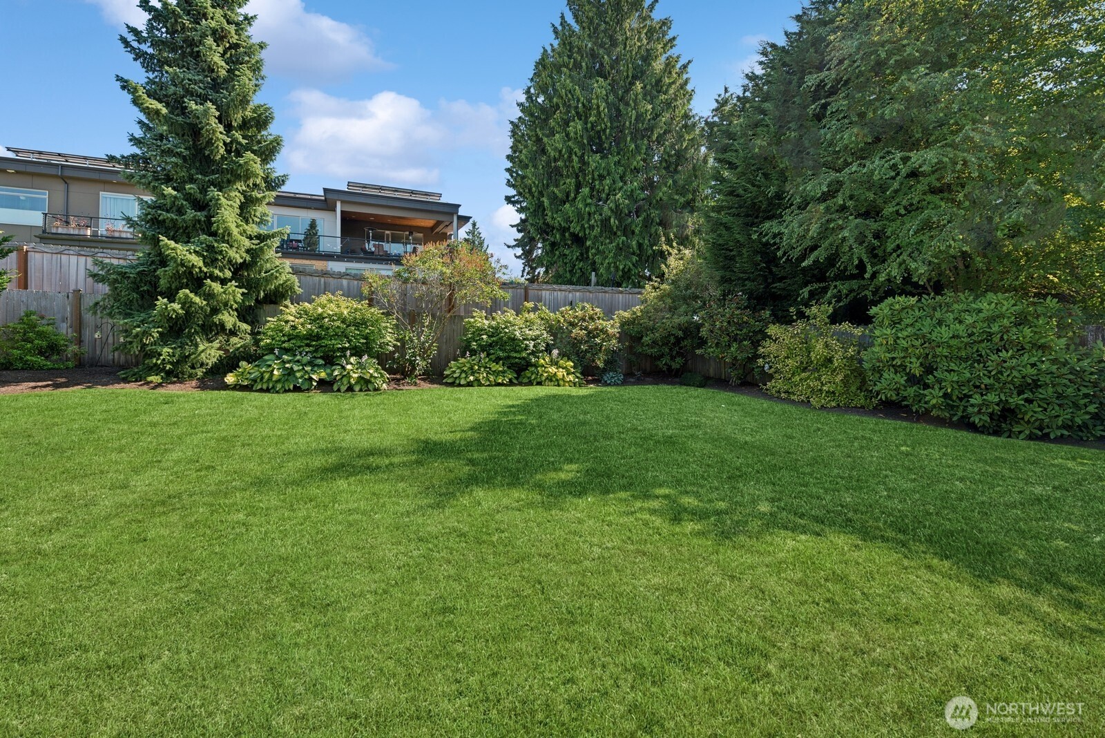 918 Daley Street Edmonds, WA 98020 - Photo 29 of 32 a view of garden with a building in the background