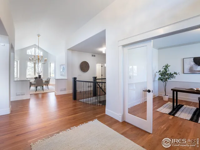 a view of living room filled with furniture and wooden floor