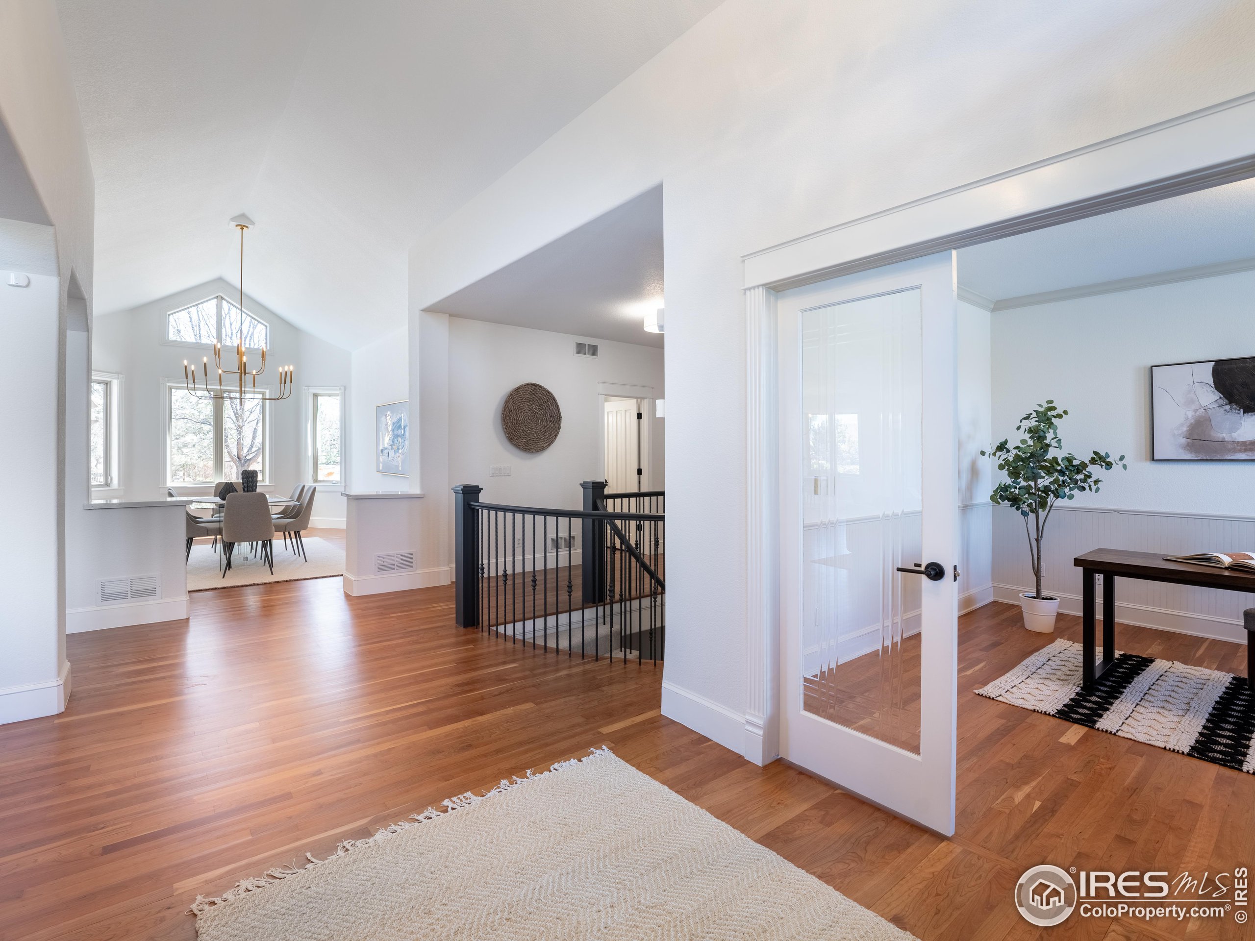 385 Baxter Farm Lane Erie, CO 80516 - Photo 16 of 40 a view of living room filled with furniture and wooden floor