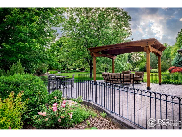 a view of a backyard with a small deck