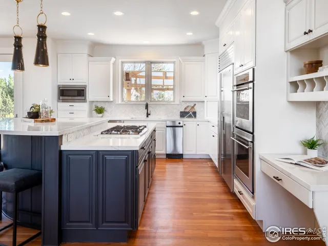 a kitchen with a sink stove and refrigerator