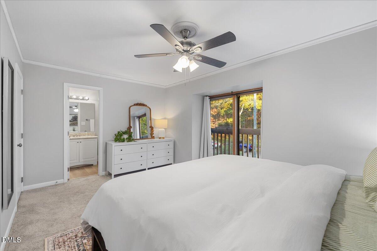 5821 Mapleridge Road Raleigh, NC 27609 - Photo 22 of 38 a bedroom with a large bed and a window