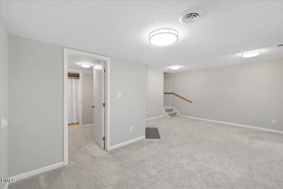 5821 Mapleridge Road Raleigh, NC 27609 - Photo 29 of 38 an empty room with a bathroom
