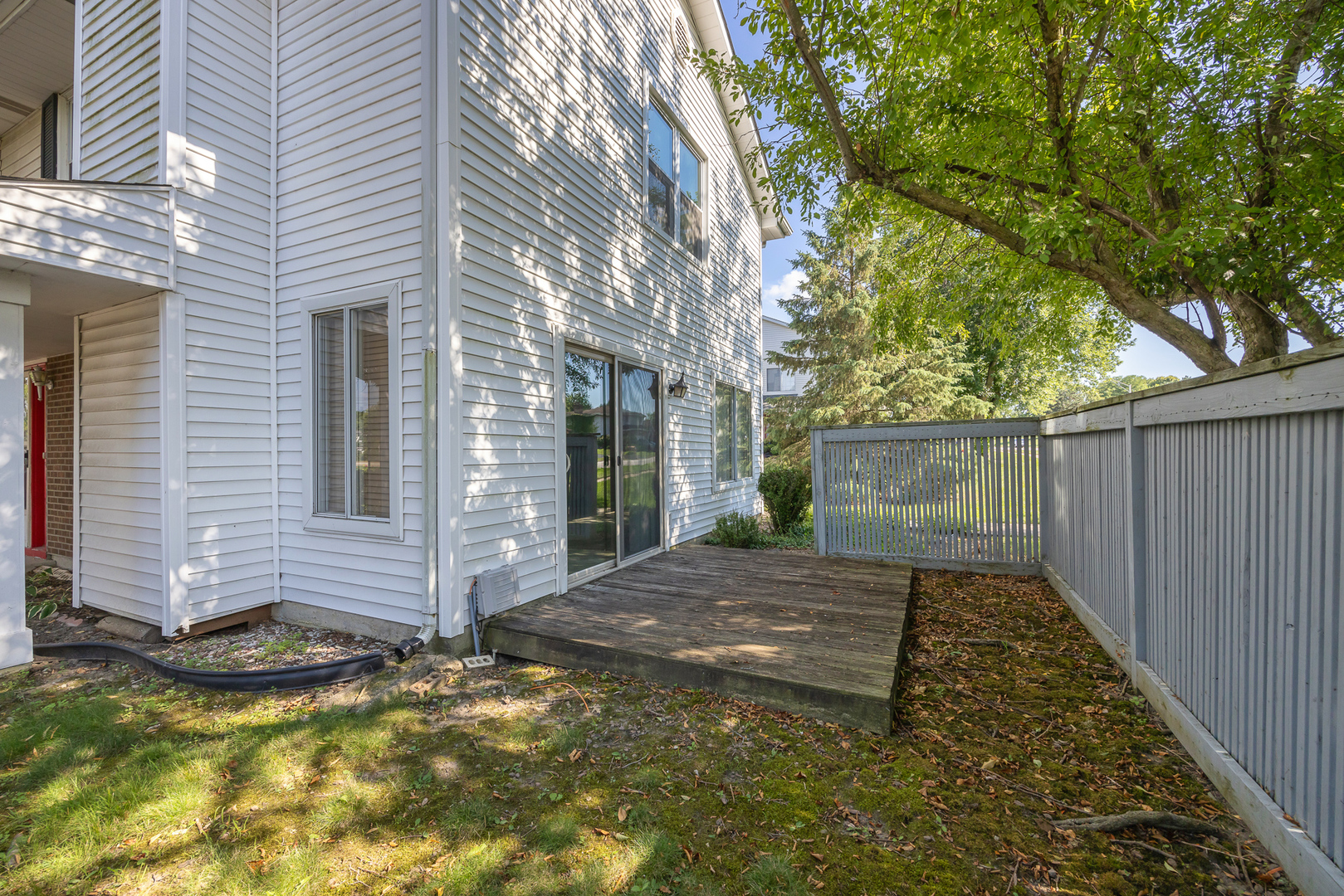 9 Red Barn Road Matteson, IL 60443 - Photo 17 of 18 a view of a backyard with brick wall and a large tree
