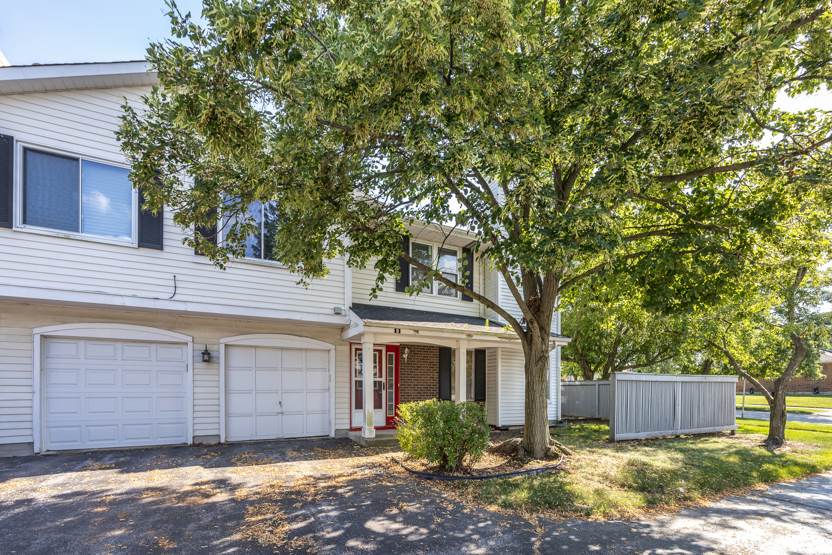 9 Red Barn Road Matteson, IL 60443 - Photo 2 of 18 a front view of a house with a garden