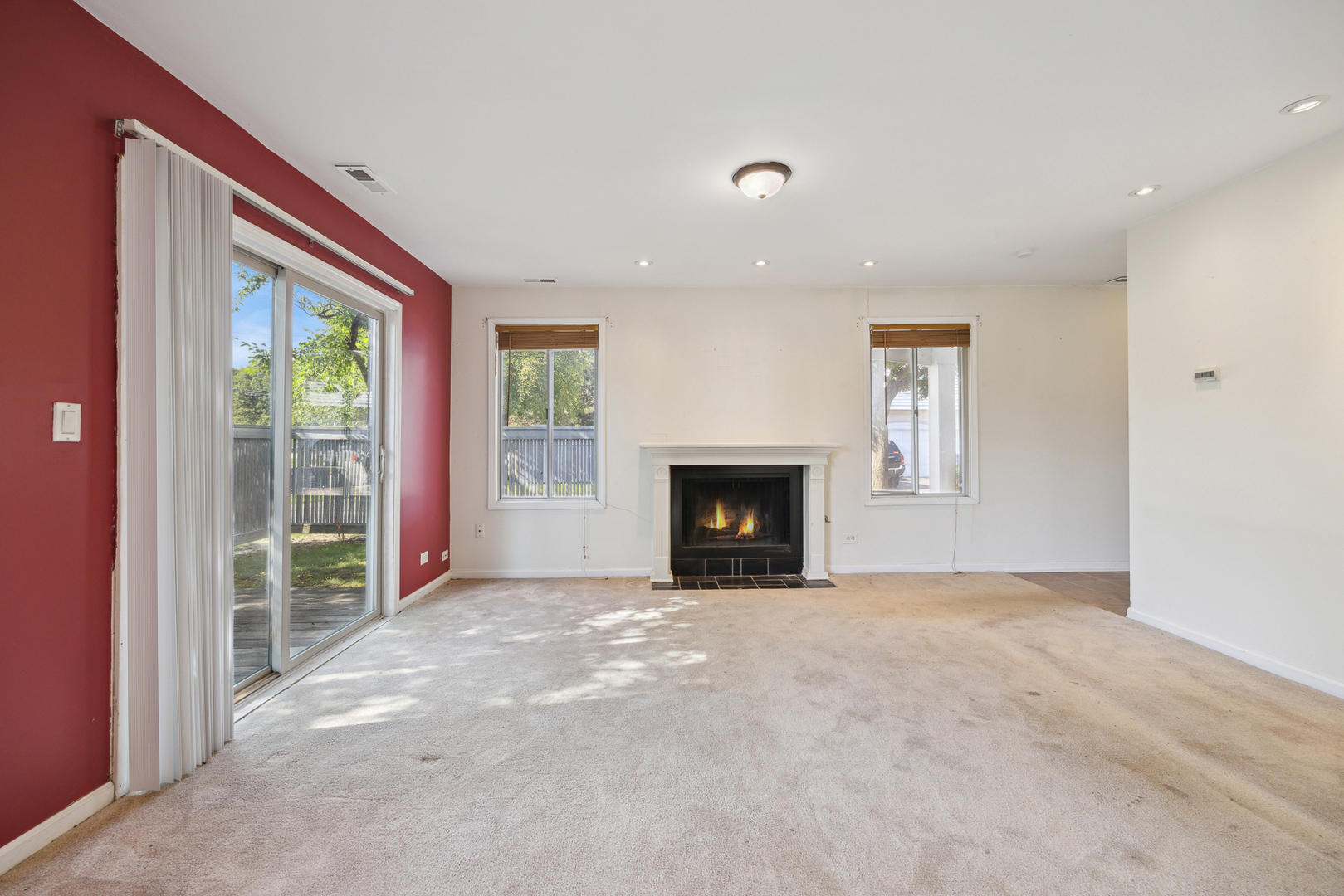 9 Red Barn Road Matteson, IL 60443 - Photo 6 of 18 an empty room with windows and fireplace