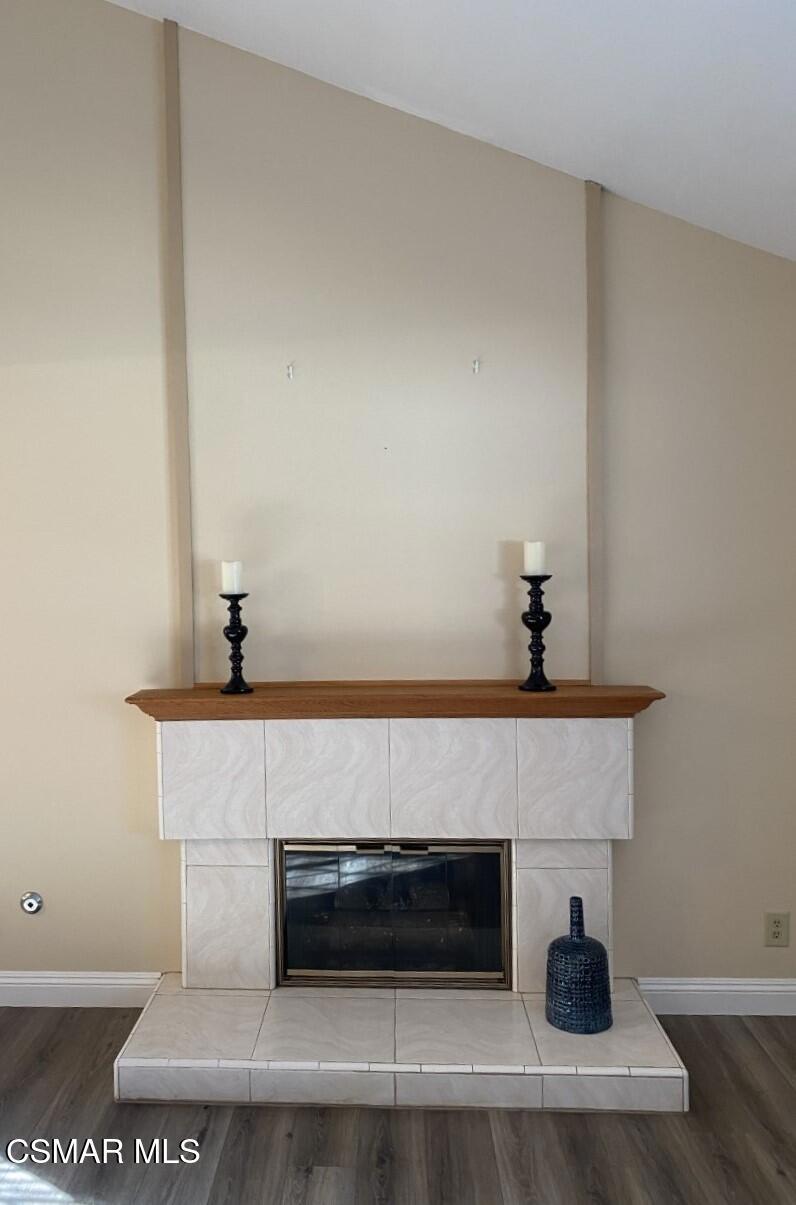 652 Harper Street Simi Valley, CA 93065 - Photo 11 of 27 a living room with a fireplace and wooden floor