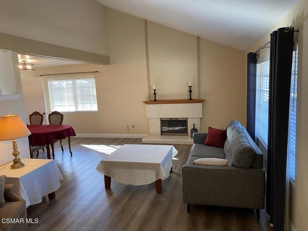 652 Harper Street Simi Valley, CA 93065 - Photo 13 of 27 a living room with furniture dining table and a fireplace