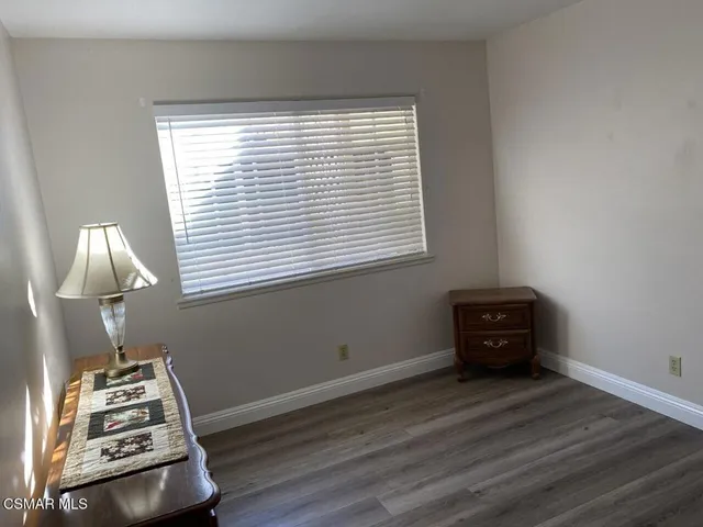 a room with window and wooden floor