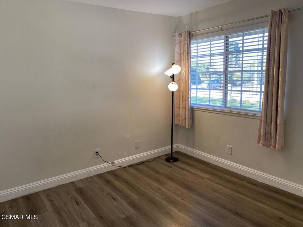 652 Harper Street Simi Valley, CA 93065 - Photo 20 of 27 an empty room with wooden floor and windows