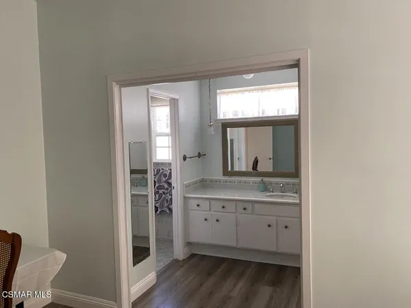 a view of a sink and a mirror
