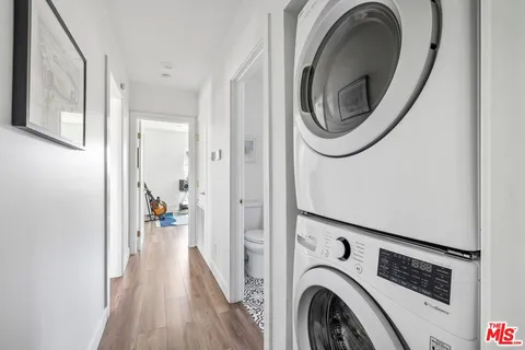 a view of storage and utility room with washer and dryer