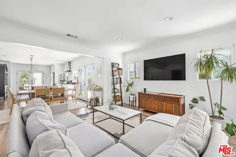 a living room with furniture fireplace and a flat screen tv