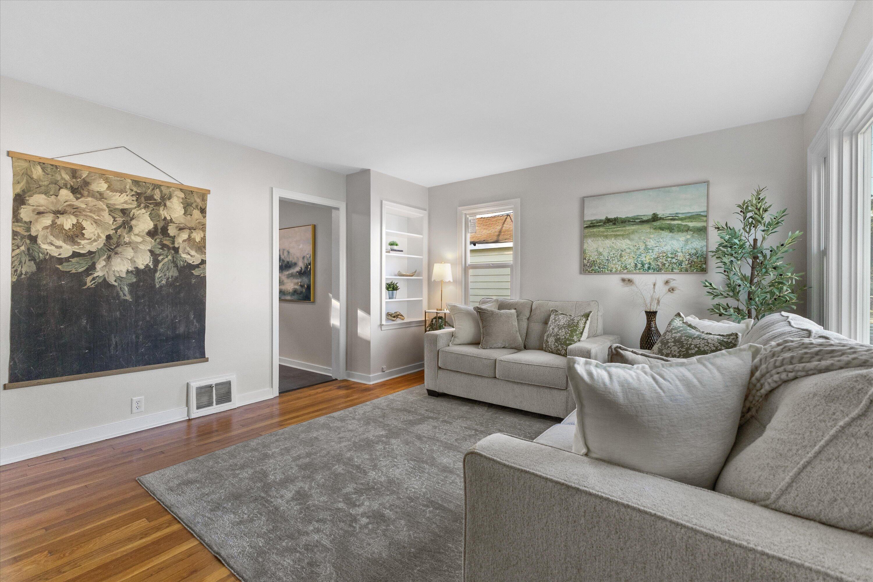 1905 Gilson Street Racine, WI 53403 - Photo 13 of 13 Neutral décor and warm hardwood floors create a comfortable, move-in-ready living space with an easy flow to the rest of the home.