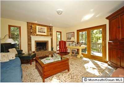 13 Abbey Road Jackson, NJ 08527 - Photo 3 of 3 a living room with furniture large window and a fireplace