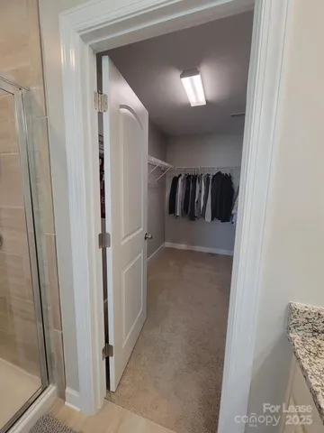 a view of a hallway with a livingroom