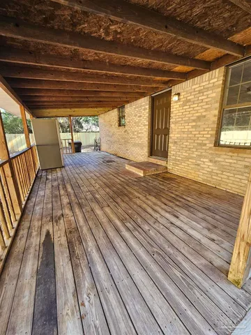 a view of outdoor space with wooden floor