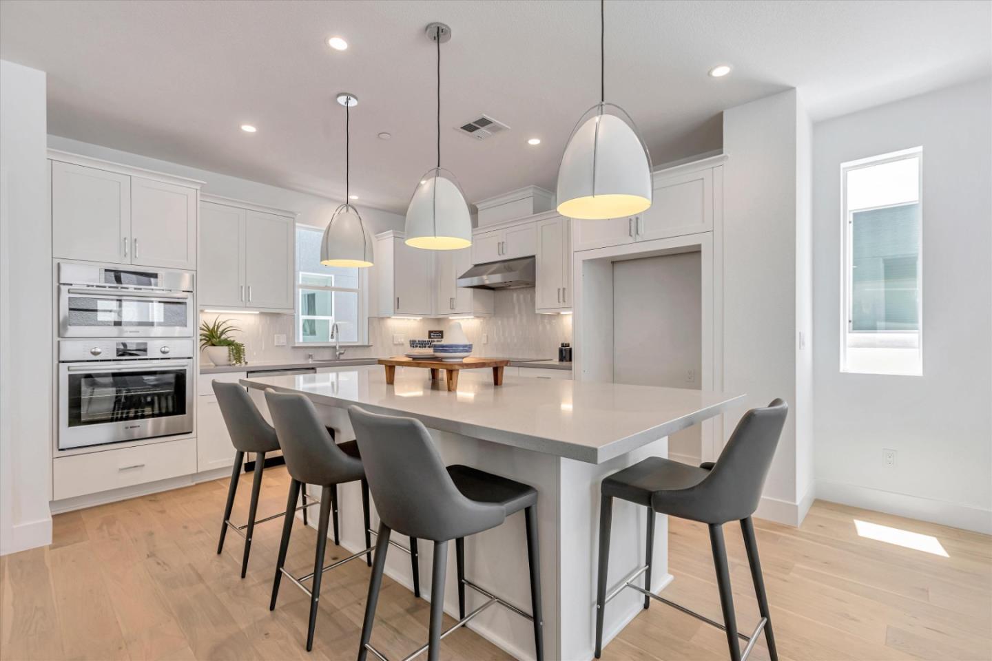 521 Lapis Court San Ramon, CA 94583 - Photo 11 of 20 a kitchen with stainless steel appliances granite countertop a table chairs sink and cabinets
