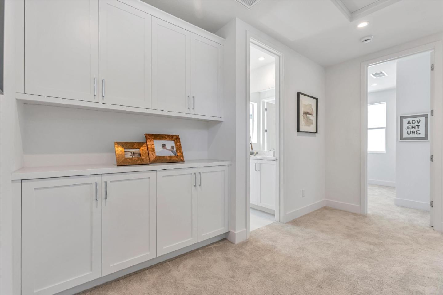 521 Lapis Court San Ramon, CA 94583 - Photo 18 of 20 a kitchen with white cabinets and a refrigerator