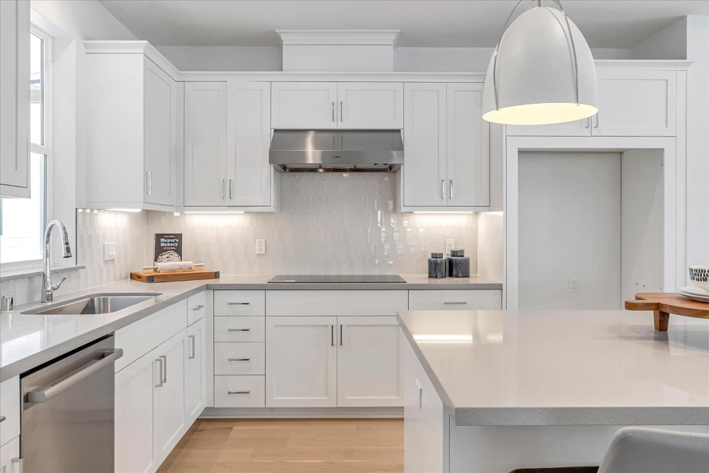 521 Lapis Court San Ramon, CA 94583 - Photo 6 of 20 a kitchen with white cabinets appliances and a sink
