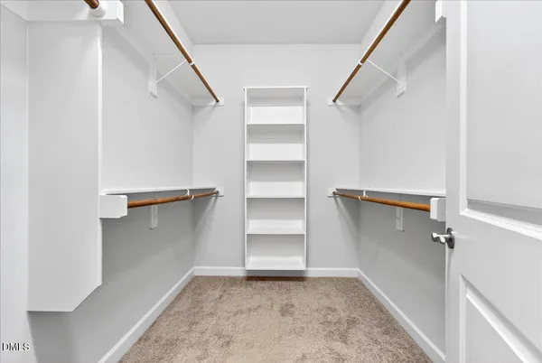 a utility room with dryer and bicycles