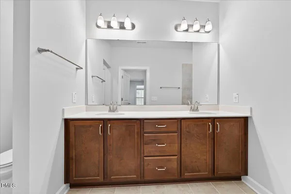 a view of an empty room with a ceiling fan