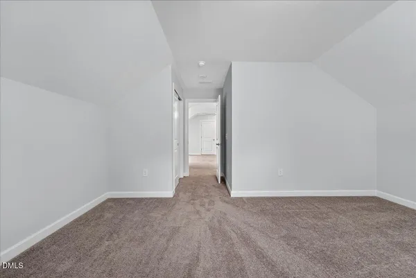 a picture of a room with a white wall and a picture