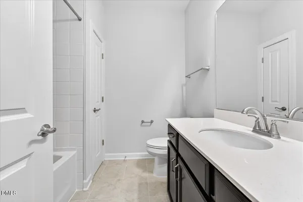 a bathroom with a sink toilet and vanity