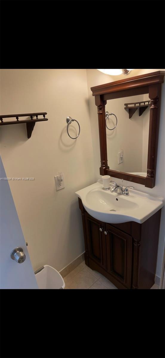 8255 Abbott Avenue, Unit 402 Miami Beach, FL 33141 - Photo 12 of 32 a view of kitchen island with sink