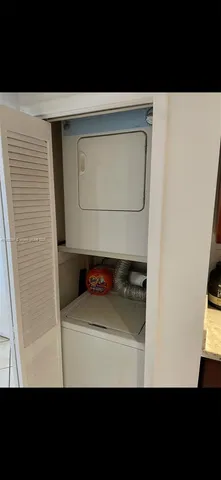 a view of a bedroom with a bed