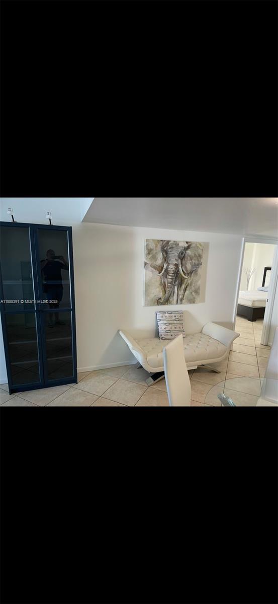 8255 Abbott Avenue, Unit 402 Miami Beach, FL 33141 - Photo 17 of 32 a view of table and chair