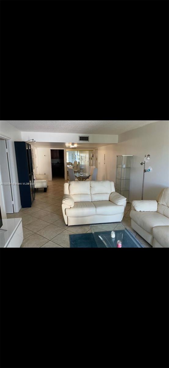 8255 Abbott Avenue, Unit 402 Miami Beach, FL 33141 - Photo 2 of 32 a bathroom with a sink and a mirror