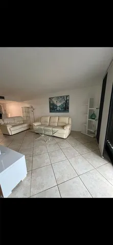 a view of a room with a bed