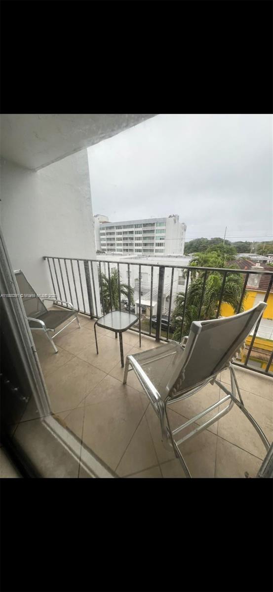8255 Abbott Avenue, Unit 402 Miami Beach, FL 33141 - Photo 22 of 32 a view of a terrace with lake view