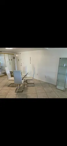 a view of wooden floor and a cabinet