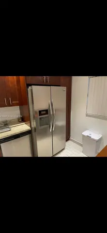 a view of kitchen area with wooden floor