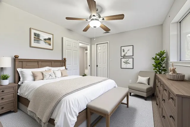 a bedroom with a large bed and a couch