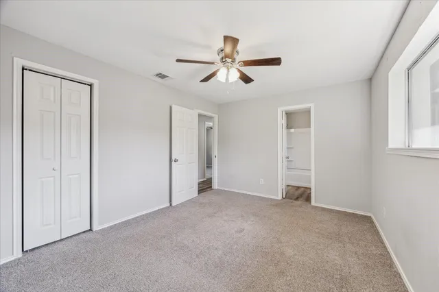 a view of empty room with windows