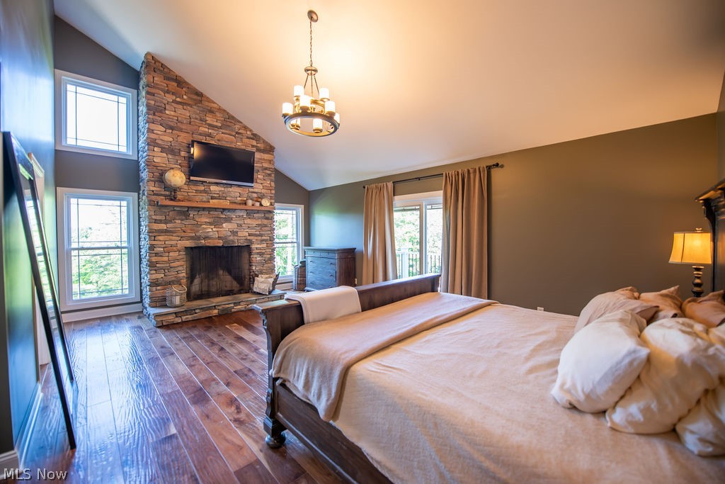 5234 Ribbon Road Southwest Bowerston, OH 44695 - Photo 23 of 50 Spacious and sunlit primary bedroom featuring stone fireplace